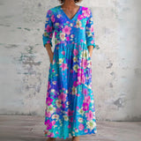 Roxy blue maxi dress with bright tropical florals, front view