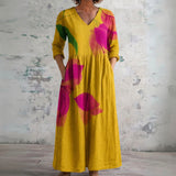 Portia mustard maxi dress with bold blooms, front view