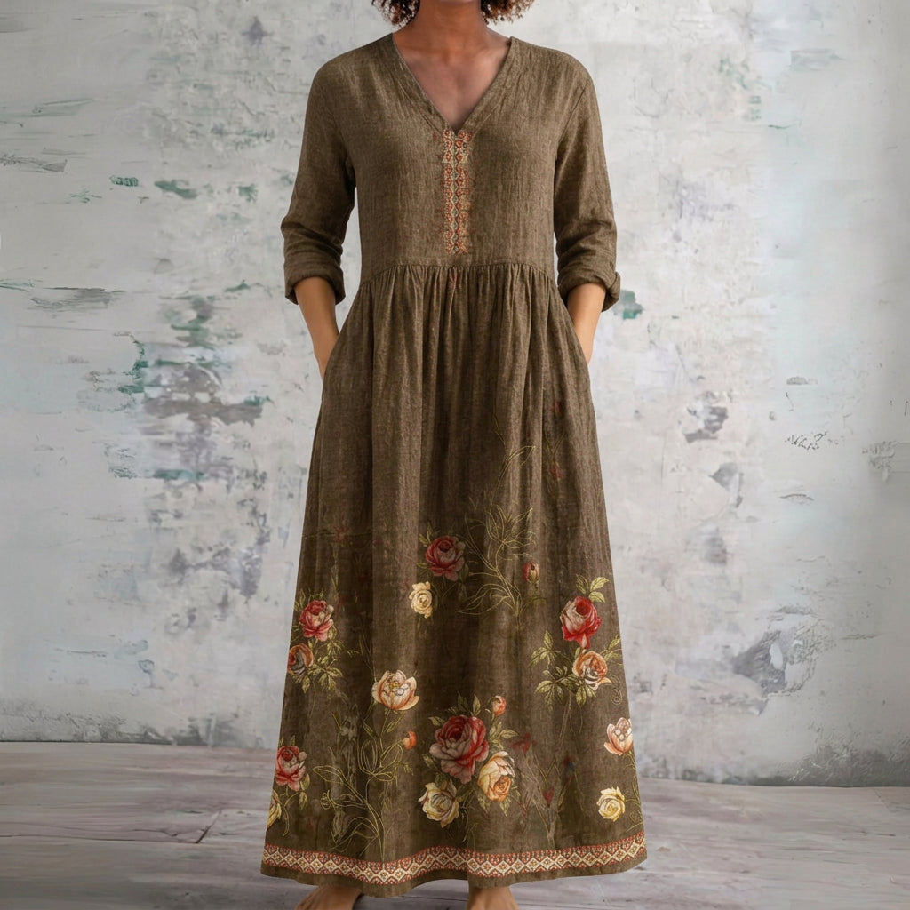 Deb brown maxi dress with floral border, front view