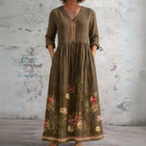 Deb brown maxi dress with floral border, front view