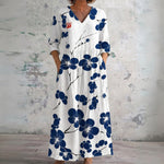 Kara white maxi dress with navy blossom branches, front view