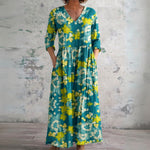 Kiri teal maxi dress with yellow blossoms, front view
