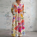 Maggie cream maxi dress with folk figures, front view