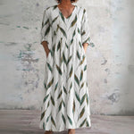 Tess white maxi dress with green leaf sprigs, front view