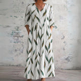 Tess white maxi dress with green leaf sprigs, front view
