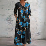Olive black maxi dress with sapphire blossoms, front view