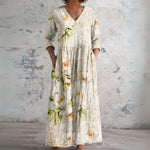 Sybil cream maxi dress with soft blossoms, front view