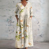 Sybil cream maxi dress with soft blossoms, front view